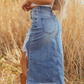 Damkjol i hög midja med slitningar i denim